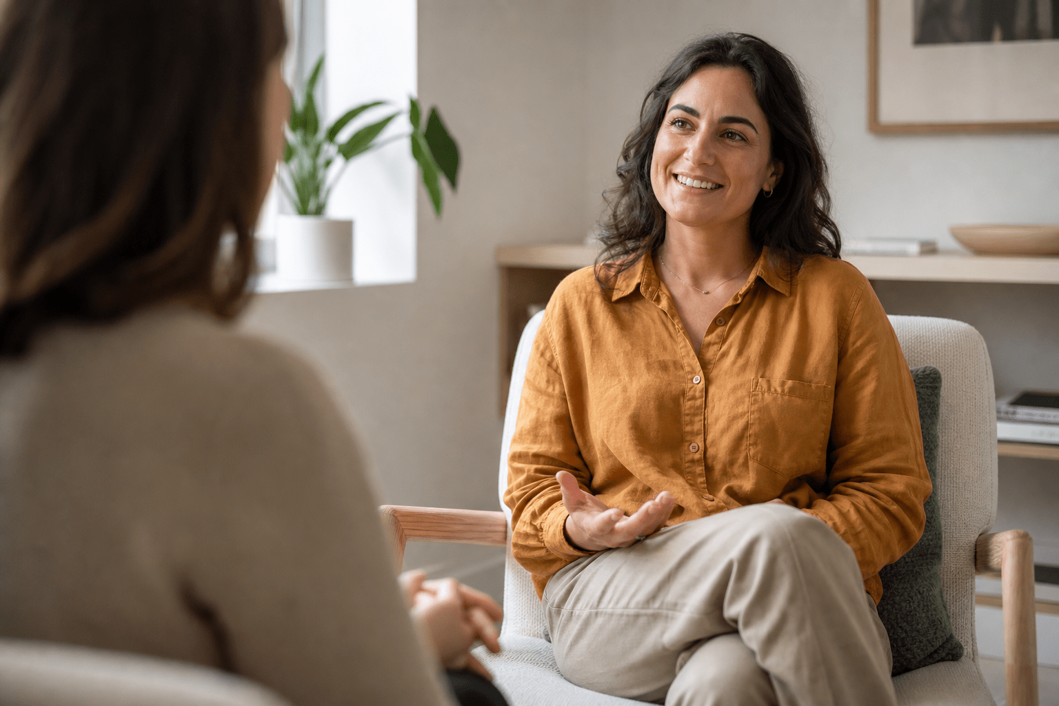 A relaxed client smiling during a counselling conversation