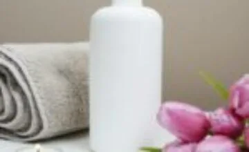 A warm bath prepared with towels in a softly lit bathroom